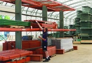 An employee of SJF checking inventory tags in SJF's New Rack Building
