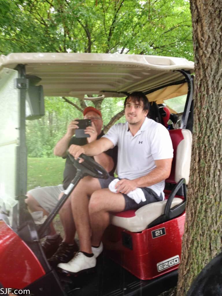 Sam and Vance golfing for charity