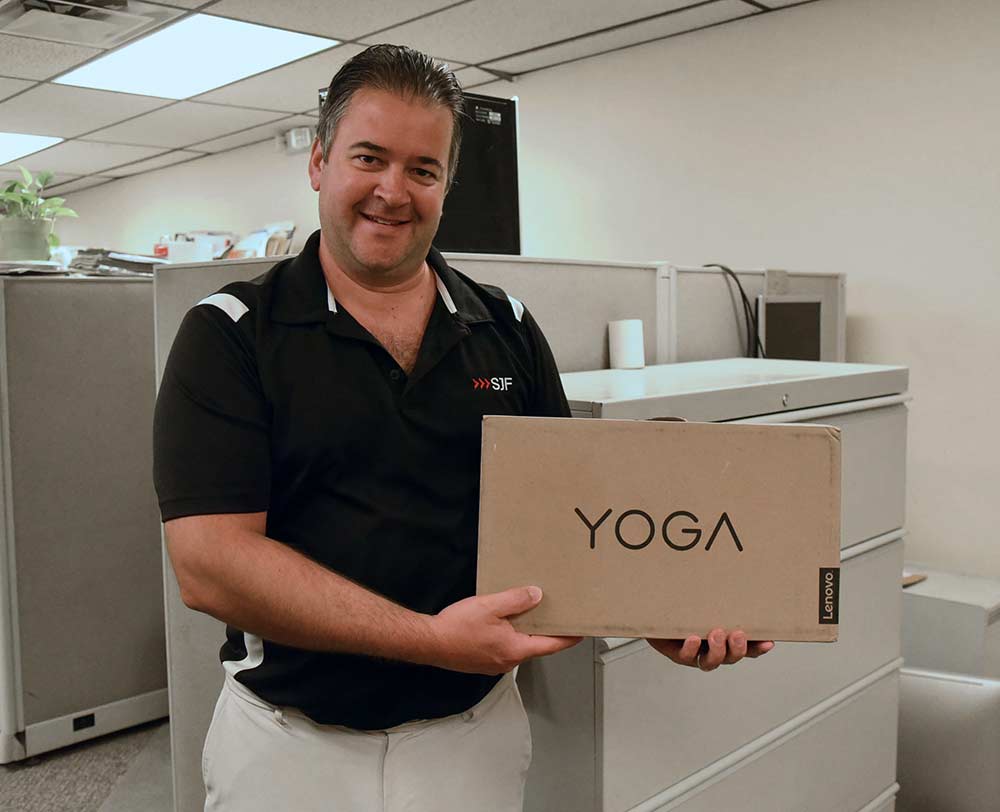 Ed Salonek takes home the grand prize of a Yoga Lenovo laptop