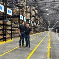 Sam and Frank Sterner in a warehouse