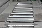 Roller Assisted Trash Conveyor