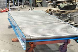 This 2.5 inch diameter roller drive shaft lineshaft conveyor has 120 foot runs with 2.5 inch rollers on 3 inch centers.