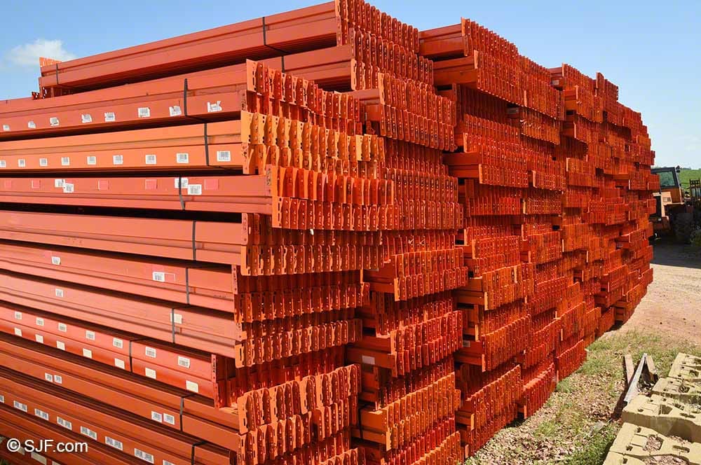 Stacked heavy-duty steel pallet rack beams for warehouse shelving